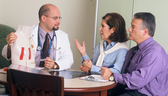 doctor-and-couple-talking-pv